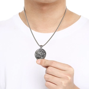 Detailed view of Nordic Viking wolf and raven totem pendant on stainless steel chain