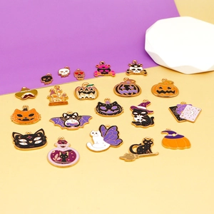 Detail view of various Halloween alloy charms including pumpkins and black cats