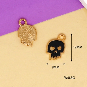 Detailed view of Halloween skull charm with 12mm x 9mm dimensions and weight info