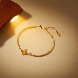 Elegant 18K gold-plated stainless steel butterfly bracelet with luxury brushed metal finish