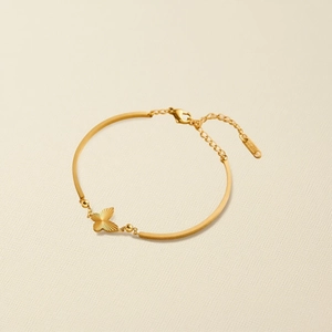 Detailed close-up of butterfly bracelet with S.STEEL engraving on lobster clasp tag
