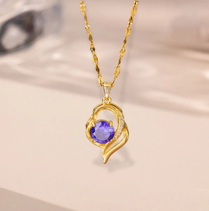 Elegant 18k gold heart necklace with a round purple gemstone and small side diamonds