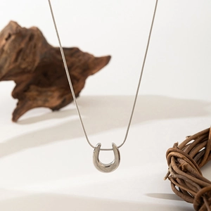 Minimalist silver U-shape horseshoe pendant necklace with sleek snake chain for women