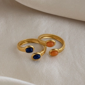 Detail of 18K gold-plated stainless steel rings with lapis lazuli and carnelian stones