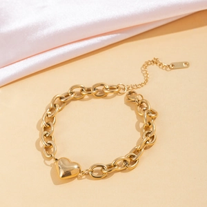 Élégant bracelet doré avec pendentif cœur et chaîne à maillons épais ajustable