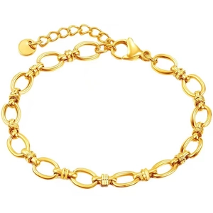 Detail of 18K gold plated Cuban chain necklace with textured oval links and lobster clasp