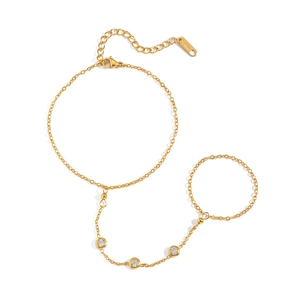Gold-plated titanium steel slave bracelet with zircon accents on white background.