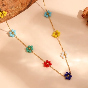Detailed view of colorful beaded flower charms on a gold titanium steel chain