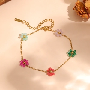 Close-up of a colorful beaded flower bracelet with gold stainless steel chain