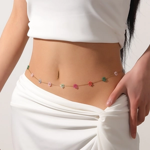 Detailed view of a summer flower waist chain with colorful beads on a model