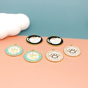 Detailed view of colorful enamel cat themed charms with cute slogans and paw designs