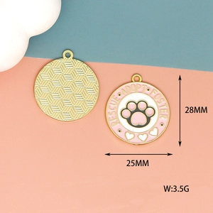 Detail view of pink enamel cat paw charm with rescue adopt foster text and measurements