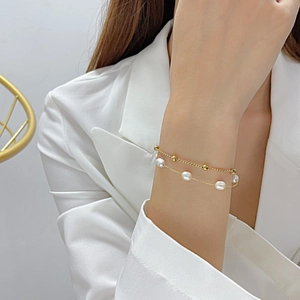 Elegant double-layered gold beaded bracelet with three freshwater pearls for women