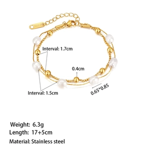 Double-layered golden stainless steel bracelet with white freshwater pearls and gold beads