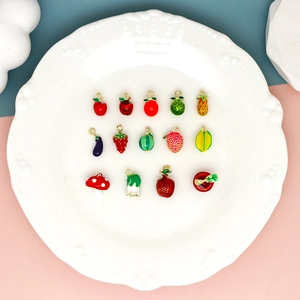 Collection of colorful fruit and vegetable enamel charms for DIY jewelry making