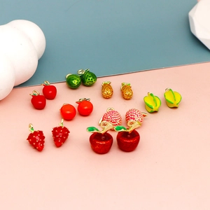 Detailed view of various colorful 3D fruit enamel charms for handmade DIY jewelry accessories