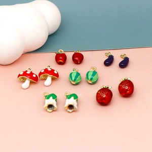 Detailed view of cute 3D simulated fruit and vegetable alloy enamel charms for DIY jewelry.