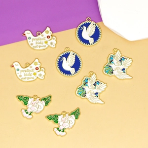Detailed view of assorted enamel dove and bird charms for DIY jewelry making