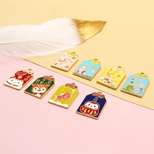 Colorful Omamori lucky charms with cute animal designs and blessing text for DIY