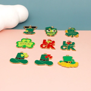 Detail showing various St. Patrick's Day themed enamel charms with gold-plated edges.