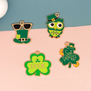 Detailed view of Saint Patrick's Day themed green clover and lucky hat enamel charms