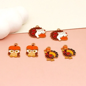 Detailed view of Thanksgiving cartoon enamel charms featuring turkey, owl, and hedgehog