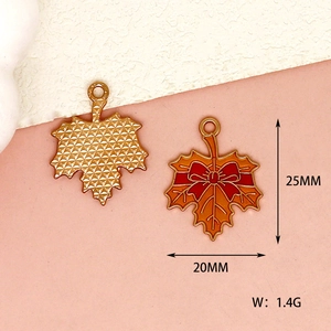 Detailed view of enamel maple leaf charm showing front and back with size dimensions