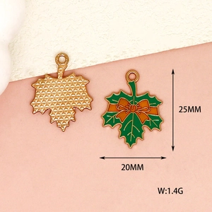 Close-up detail of green enamel maple leaf charm with dimensions and weight info