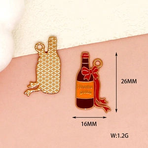 Detailed view of Thanksgiving wine bottle enamel charm with 26mm x 16mm size markings