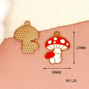 Detailed view of red mushroom enamel charms showing dimensions 23mm by 18mm and weight