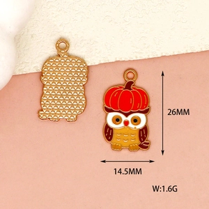 Detailed view of cartoon owl charm with pumpkin hat showing both sides and dimensions
