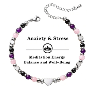 Macro view showing the heart charm and colorful 6mm beads of the protection bracelet
