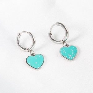 Elegant gold-tone stainless steel hoop earrings with sparkling light blue heart charms
