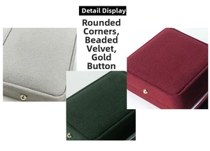 Detailed close-up of velvet jewelry boxes with rounded corners and golden metal buckles