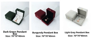 Three velvet jewelry boxes in green, red, and gray with golden buckles, size 70x70x40mm