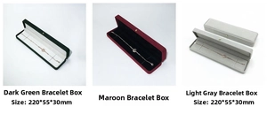 Three long velvet jewelry boxes in dark green red and grey for bracelets and necklaces