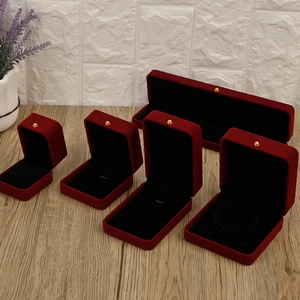 Elegant wine red velvet jewelry box set with golden button and black interior lining