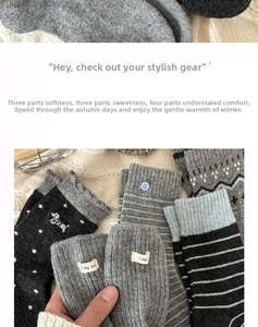 Detail of wool socks showing dog embroidery, stripe patterns, and knit textures