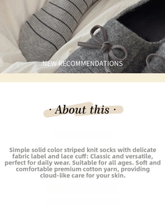 Detail of grey striped knit cotton socks featuring a delicate fabric label and frilled edge