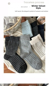 Close-up of soft wool striped socks in grey and blue tones for autumn and winter warmth