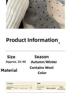 Detailed close-up of thick winter wool socks with polka dot patterns and embroidery textures