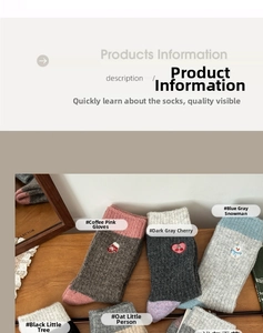 Detail of wool knit socks featuring festive embroidery and ribbed cuffs on wood