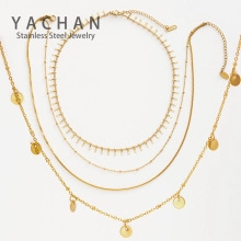 Macro shot of gold-plated 304 stainless steel multi-layer chains with round pendants