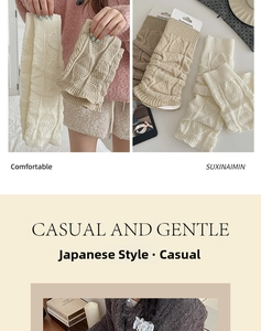 Detailed cable knit texture of beige and cream leg warmers in a soft wool blend