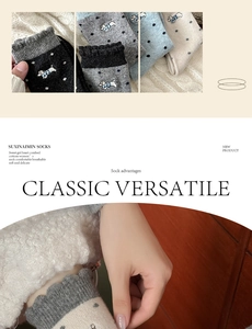 Detailed view of combed cotton socks with dog embroidery and vintage polka dots
