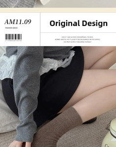 Brown mid-tube socks featuring vintage vertical ribbed texture worn with a black skirt