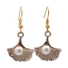 Detail of ginkgo leaf dangle earrings with gold hooks and white imitation pearls