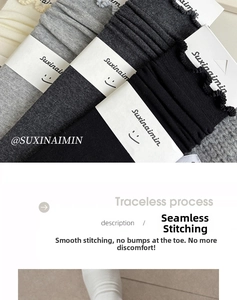 Macro detail of seamless toe stitching on cotton ruffle socks in various grey shades