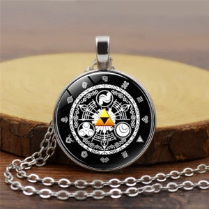 Detail of Zelda Gate of Time glass pendant with golden Triforce icon on silver chain