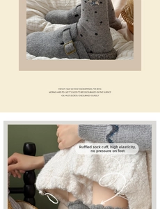 Close-up of winter wool socks featuring cute dog embroidery and scalloped cuffs